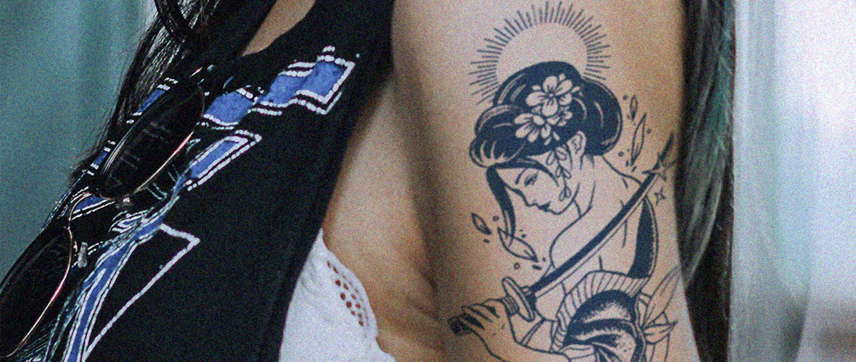 Title: Embrace Your Inner Warrior: The Allure of a Geisha with Katana Tattoo