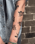 Temporary tattoos showcasing a mix of designs on an arm, embodying street style and artistic flair.