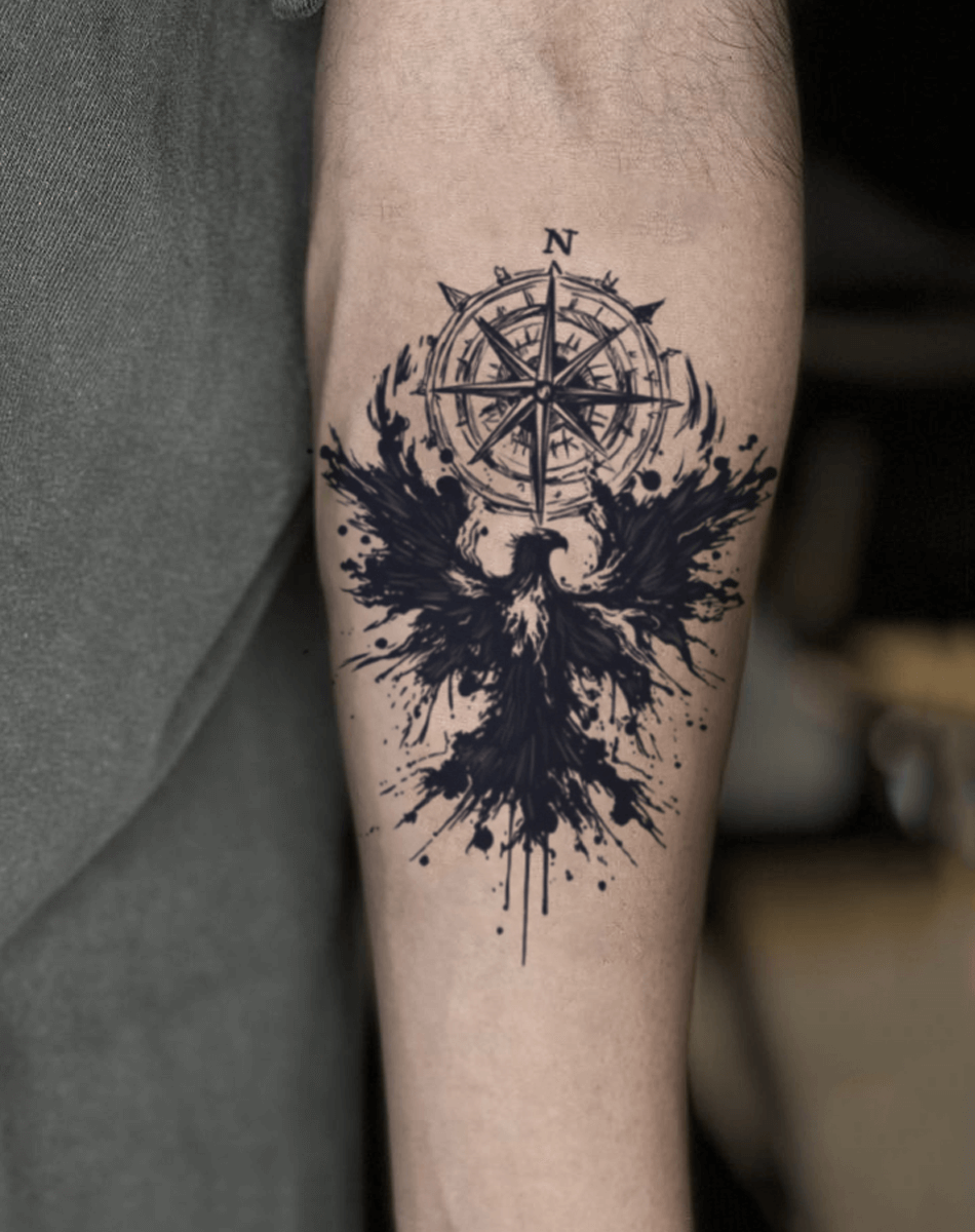 Stunning temporary tattoo of a phoenix and compass, showcasing bold black ink and artistic splashes for cool body decoration.