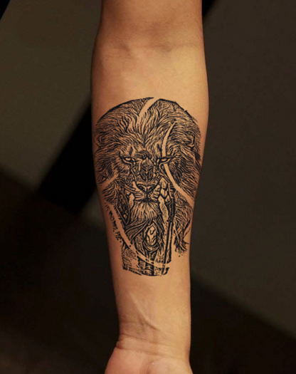 Detailed lion tattoo design on a forearm showcasing bold lines and intricate details, representing strength and creativity.